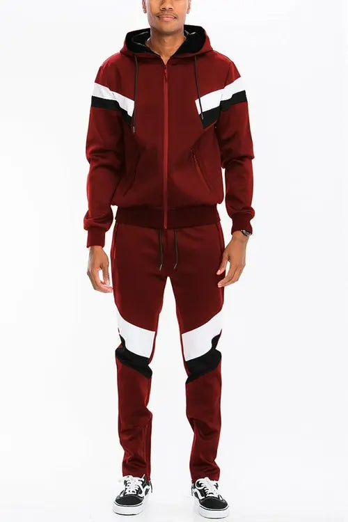 Maroon tracksuit with white and black accents on a white background