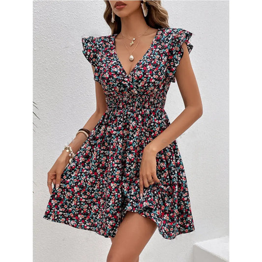 Woman wearing a floral dress against a light background